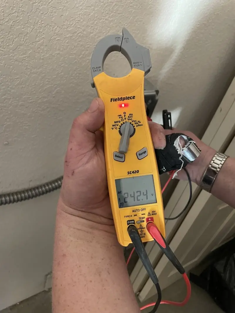 Voltage testing with clamp meter during Outlet Installation in Darlington